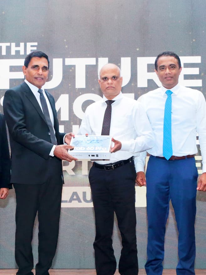 resenting a tab to the Sri Lanka Police, symbolizing the grant of 500