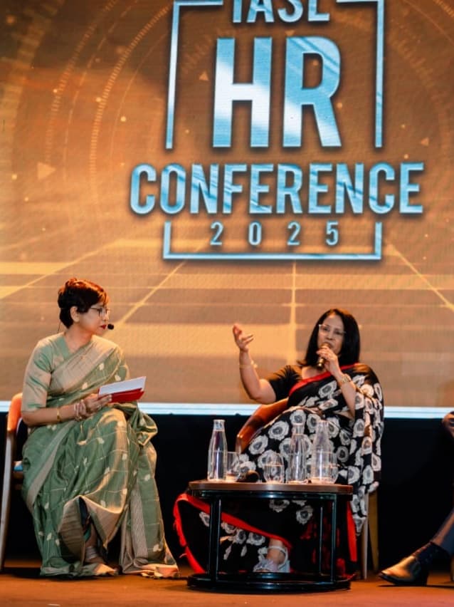 Two women share insights on stage, sparking ideas and connection at the conference