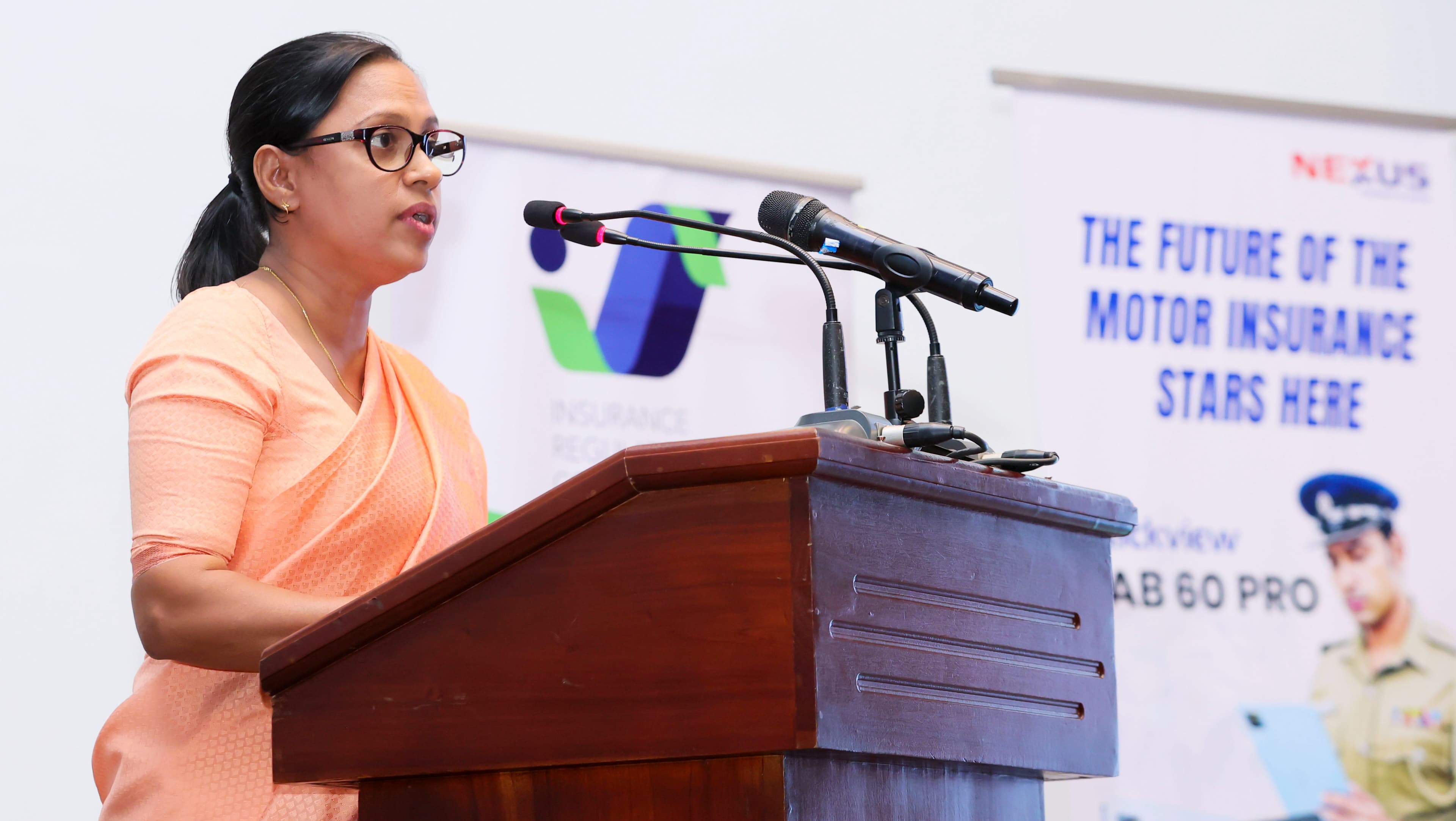 A speaker giving a speech at the e-Motor digital card launch event